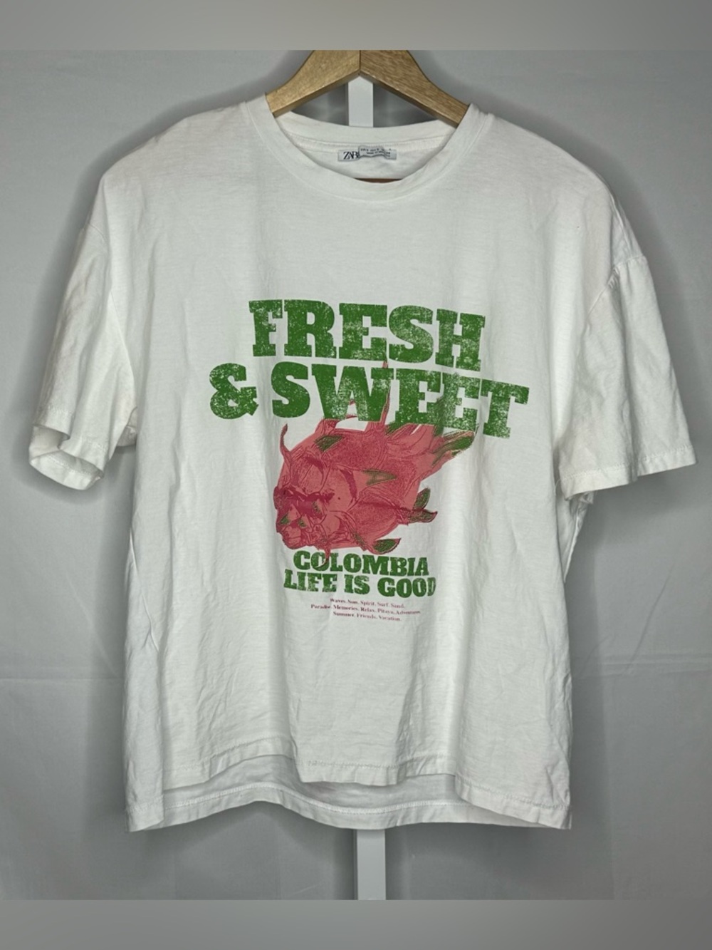 Zara White Short Sleeve Tee with Green Text & Pink Floral Graphic